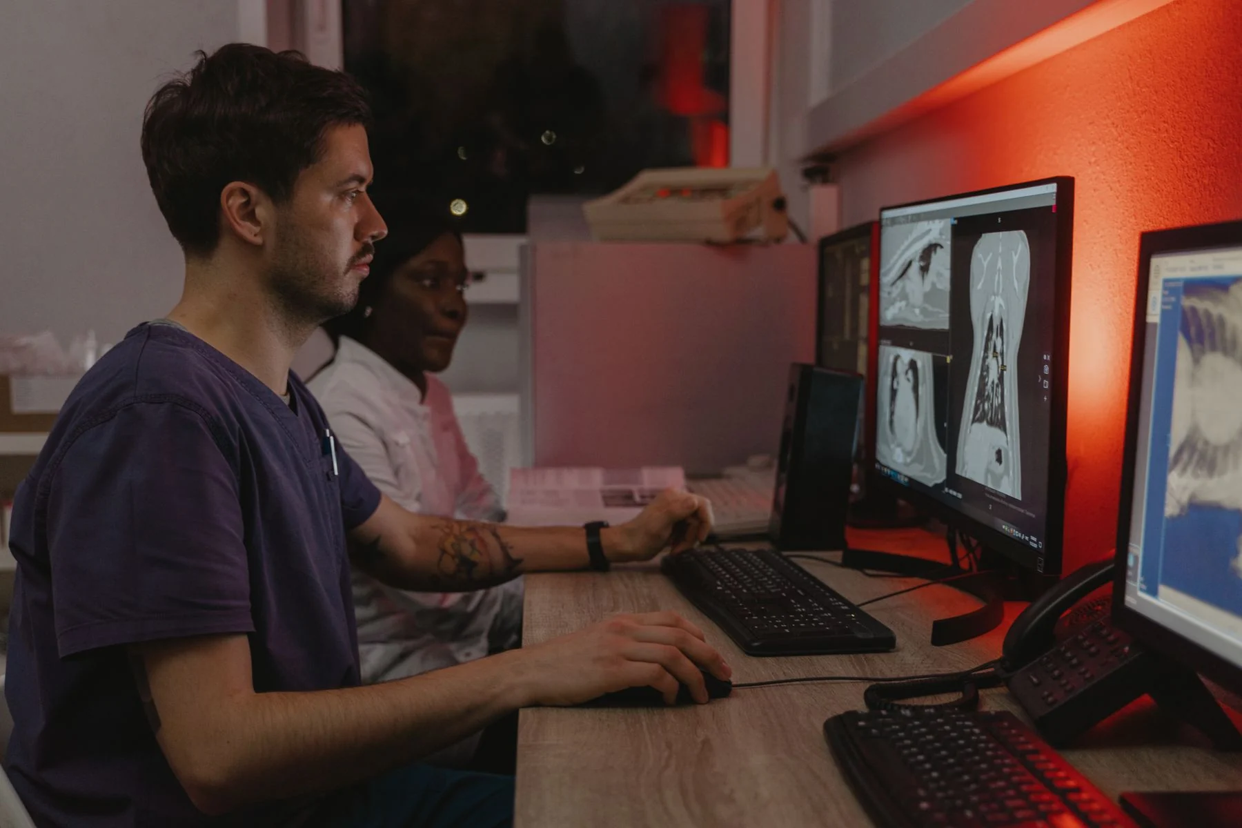 Clinicians reviewing medical scans